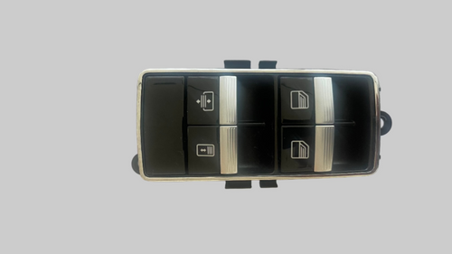 Car window switch panel on a textured white background